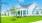 a white house with a green lawn