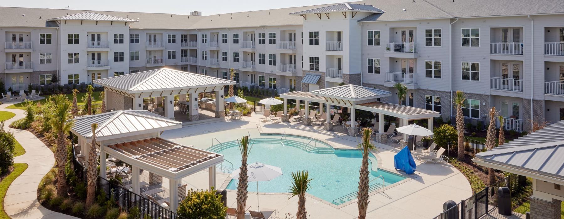 a large building with a pool