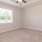 a room with a ceiling fan and a window