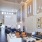 a clubhouse room with a chandelier and a couch