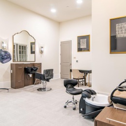 a spa room with a desk and chairs