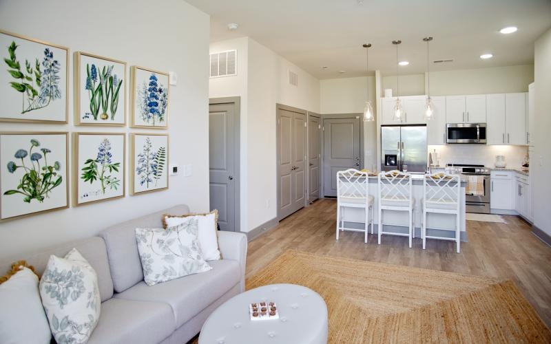 a living room with a white couch and a table