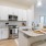 a kitchen with white cabinets