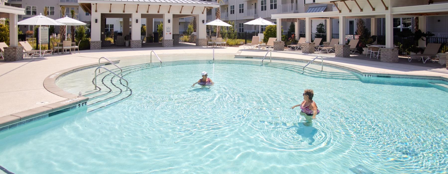 a couple people in a pool