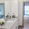 a bathroom with a sink and a bed