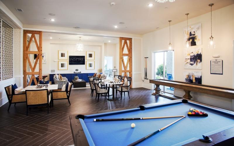 a pool table in a community room